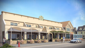Modern restaurant with outdoor seating, elegant arches, greenery, and welcoming beige facade.