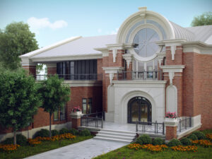 Elegant brick building with grand archway, lush gardens, and timeless architectural details.
